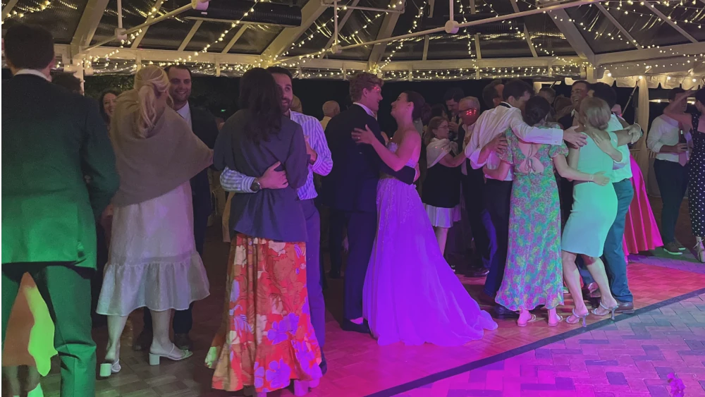 Bride dancing with guests and kids on a Michigan wedding reception dance floor