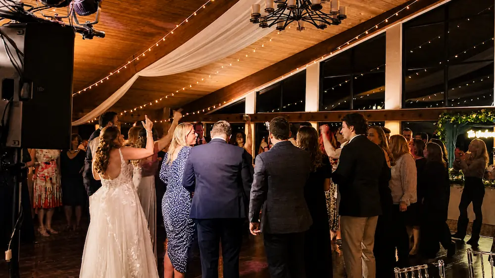 Packed dance floor at Erin and Spencer’s Paint Creek Country Club wedding reception