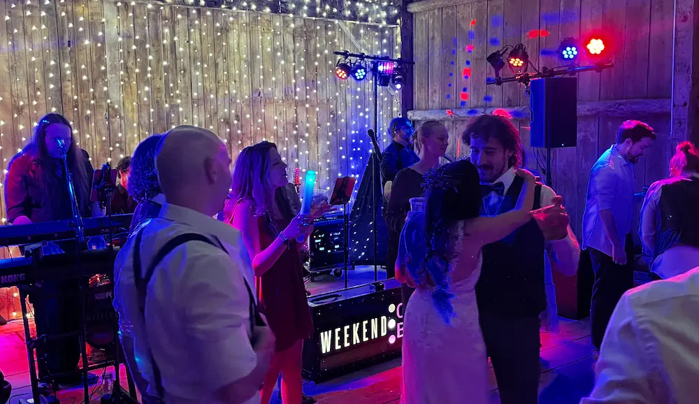 Wedding guests dancing at Vale Royal Barn reception