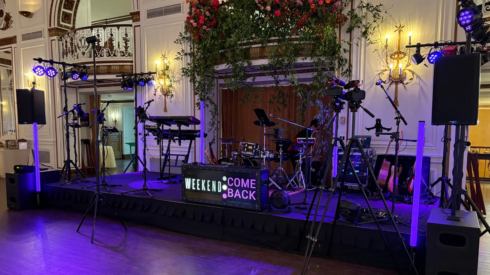 Weekend ComeBack wedding band stage, sound system, and lighting setup in a Michigan wedding venue