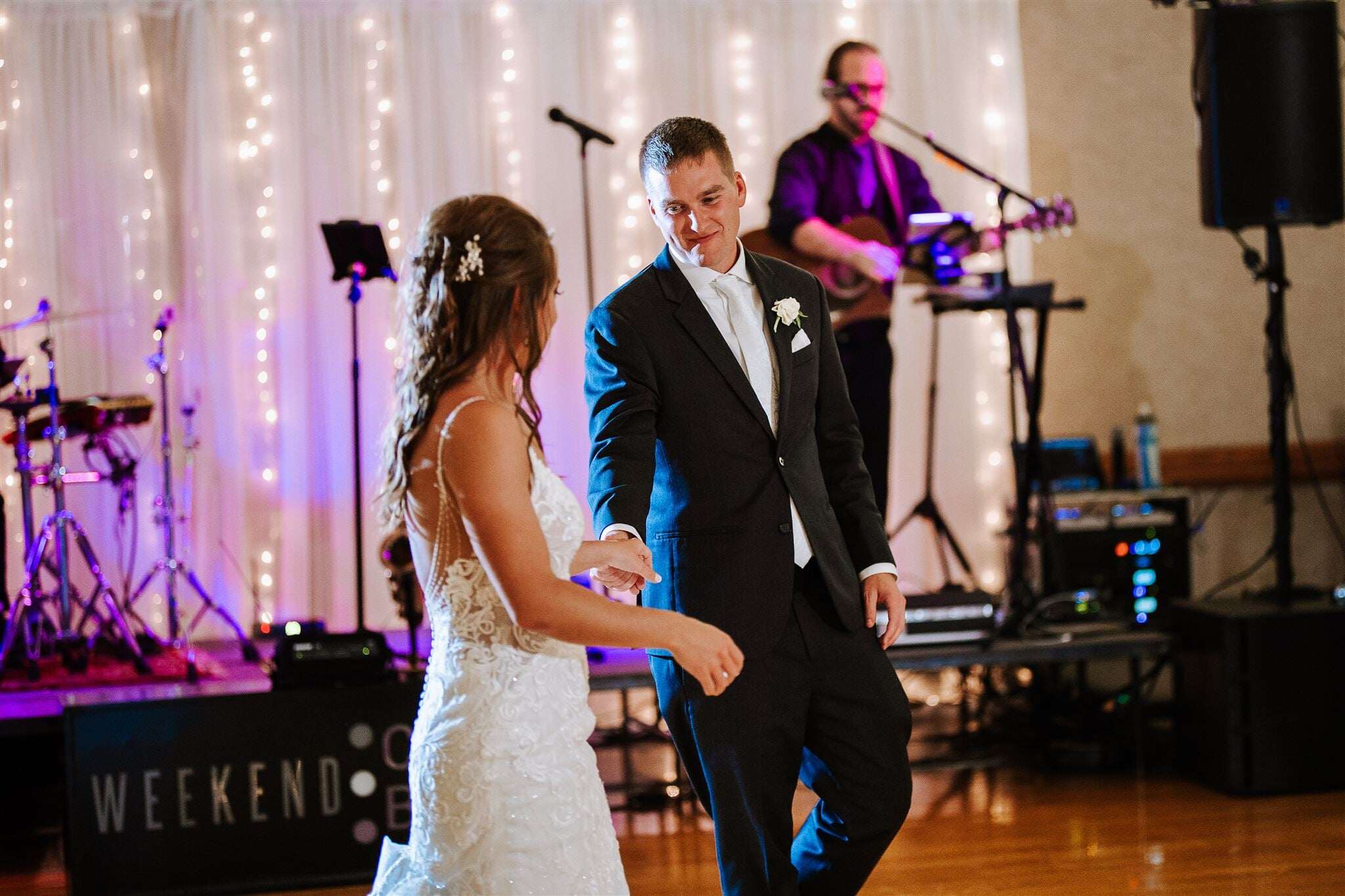 Bride and groom first dance with Weekend ComeBack performing live behind them