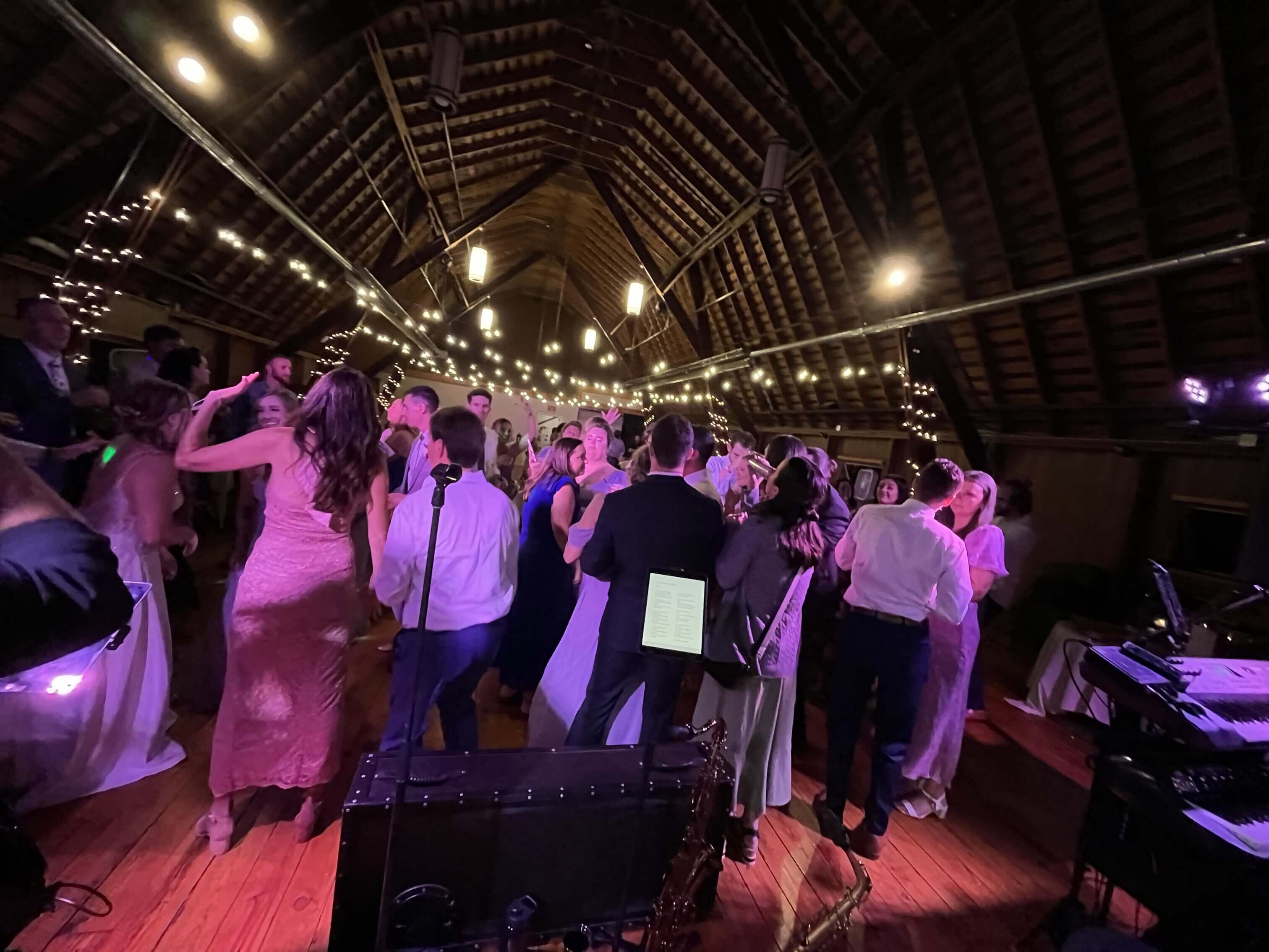 Weekend ComeBack performing to a full dance floor at Woldumar Nature Center wedding