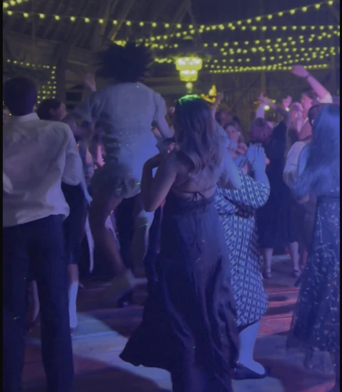 Guest jumping in the air on the dance floor at Crooked River Weddings Gladwin with Weekend ComeBack